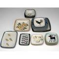 Glidden twentythree glazed ceramic dishes including three small rooster plates and seven small poodle plates largest 9 12 sq