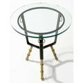 Jacques adnet side table with a basketshaped stitched leathercovered top over three brass bambooshaped legs under a circular glass top 21 x 17 12