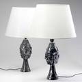 Jean marais pair of ceramic lamps with sculptural face designs covered in pewter glaze signed ceramic 17 12 x 5 12