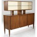 Gio ponti  singer  sons italina walnut breakfront the china cabinet with glass shelves and doors atop a server with three doors enclosing interior drawers and shelves complete with original bill o