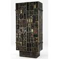 Paul evans twodoor vertical sculpture front cabinet vibrantly patinated with edges trimmed in 23k goldleaf the redwashed interior with three goldleaf drawers and numerous compartments 1972 fr