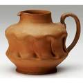 George ohr bisque pitcher with deep inbody folds and earshaped handle fleck to base script mark 3 12 x 5