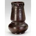 George ohr tapering vase with a squat bulbous bottom and a crimped rim covered with a pebbled matte metallic mahogany finish repair to chip on one ruffle impressed mark 6 x 3 34