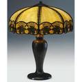 Handel table lamp its faceted shade of caramel slag glass with a band of applied oak leaves over a threesocket base decorated with tall leaves and buds base stamped handel 24 x 18