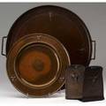 Roycroft four hammered copper items in the trillium pattern a pair of bookends and two circular trays stamped with early orb and cross marks trays 10 and 15 dia