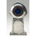 Liberty  co tudric pewter art nouveau clock with stylized trees and enamaled blue and gold dial stamped tudric 0371 9 x 4 12