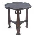 Charles rohlfs carved tea table with a floriform top over three legs and lower shelf unmarked 26 x 26 dia