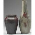 Dedham two experimental vases by hugh robertson one covered in oxblood glaze with orange peel texture the other in flowing celadon and oxblood taller vase exhibited in american arts  crafts from