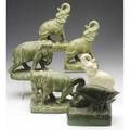Rookwood six production bookends five elephants and one with ducks all covered in green or ivory glaze elephants exhibited in american arts  crafts from the collection of alexandra and sidney sh