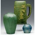 Van briggle three pieces cabinet vase with buds under mottled blue and amber glaze ovoid vase with flowers under a rich matte green glaze 1914 and a mug in feathered green cabinet vase shown in