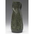 Van briggle vase deeply carved with a flower and tall leaves under a fine curdled matte green glaze the clay showing through c 1906 exhibited in american arts  crafts from the collection of al