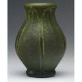 Grueby bulbous vase with fullheight leaves covered in a thick matte green glaze 14 chip to tip of leaf several minute nicks to edges overall circular pottery stamp 7 x 4 34