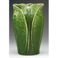 Grueby vase with pinched rim decorated with alternating leaves buds under a matte green glaze a few small flecks to edges circular pottery stamp 7 14 x 4 12