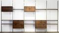 George nelson omni storage system of six vertical supports with four walnut cabinets and nine shelves unmarked 92 12 x 161 x 18