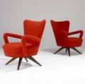 Vladimir kagan two armchairs with bright orange wool upholstery on sculpted walnut bases 33 12 x 26 12 x 22 12