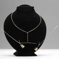 George rickey kinetic gold necklace on stand signed rickey 75 and barbara approx 9 12 x 6