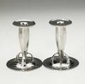 Archibald knox liberty  co pair of tudric pewter candlesticks stamped tudric 0221 5 34 x 4 34