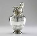 Renaissance revival silver water pitcher by vincenz mayers sohne vienna 1880 baluster form with split scroll handle and ring foot highly decorated with mask spout and handle juncture ribbons of c