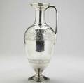 English silver neoclassical claret jug by j e w  j barnard london 1873 greek revival ewerform having brightcut palmette and scroll with rosette ribbons incised with flared foot parcel gi