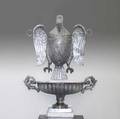 Late federal eagleform font with cistern silver over copper and brass realistically rendered eagle head removes to fill shieldform breast plate depicts lizards among swamp foliage demilune cist