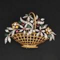 Fancy yellow  colorless diamond giardinetto brooch designed as a bounty of diamond floral clusters with bright emerald and ruby accents set among platinum and diamond foliage sculpted as basket wove