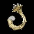 Jean schlumberger for tiffany  co clip 18k yg diamond and platinum fur clip of curved form inspired by sea creatures from which issue diamond buds and sprays approx 70 ct tw ca 1960 double