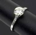 Diamond and platinum engagement ring transitional cut diamond 120 cts by formula flanked by ten accent diamonds size 9