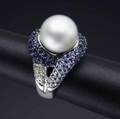 Gemset south sea pearl ring 18k wg with lustrous white pearl 1190mm centers knotted diamond and shaded blue sapphire ribbons 112 gs size 7 12