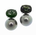 Green sapphire  tahitian pearl earrings each earring with an opal faceted green sapphire in lateral basket setting above a bluishgreen black pearl in 18k wg setting sapphires 550 cts tw pearls