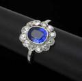 Fine sapphire  diamond ring set in platinum ca 1910 oval cushion cut sapphire 7 12mm x 6 12mm x 3 12mm approx 2 cts and twelve omc diamonds approx 1 ct tw sapphire probably of kashmir