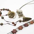 Ivory or agate jewelry or objects four pieces ca 18701930 victorian scotch agate and silver dogcollar necklace 14 x 34 hardstone bead and antique birdform netsuke necklace goatform nets