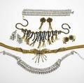 Hobe costume jewelry three suites of jewelry mid20th c colorless rhinestone set in rhodiumplated brass include broad bracelet necklace and ear clips gold fringe necklace and earring with blue