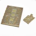 Asprey four color gold cigarette case and lighter english 9k each in the form of a book with arabesque and floral incised decorations the case with slidinglid deployment 20th c 325 gs gw case