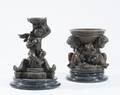 Two Cast Bronze Cherub Candleholders