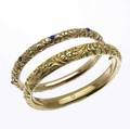 Two american rococo gold bangles 14k ca 1890 one 10mm hinged one 718mm continuous with blue cabochon gems 399 gs 2 12 x 2 int cir