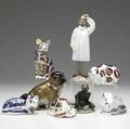 Eight assorted porcelain figural groupings 20th c four royal crown derby figures of a cat pig turtle and fox royal doulton gollum baccarat frog porelain bulldog italian glass doctor figure ta