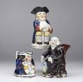 Three english tobys 19th c night watchman figure and two figural jugs tallest 10