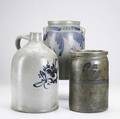 Three pieces of american stoneware pennsylvania 19th c 1 12 gallon brushdecorated tall crock 2 gallon abstract floraldecorated jug and a 1 gallon jar tallest 13 12