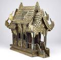 Spirit house thailand carved wood and gold leaf with ornate designs known as a spirit house or san phra phum these small homes are placed in auspicious locations and given offerings to appease t