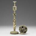 Carved ivory puzzle ball on stand 20th c ivory with serpentcarved exterior and female figure at base of stand 17