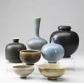 Berndt friberg  gustavsberg sevenpiece pottery lot consisting of vases and bowls in a variety of glazes all marked heights range from 2 to 7