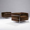 Le corbusier  cassina pair of grand confort club chairs in brown velvet upholstery on chromed steel frames marked cassina with embossed signature 24 12 x 38 12 x 28 34