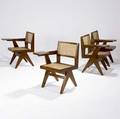 Pierre jeanneret set of four teak tabletarm chairs from chandigarh each with woven cane seat and back and fabricupholstered seat pads not shown 32 x 21 12 x 22