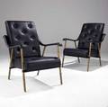 Jacques adnet pair of armchairs with tufted and stitched black leather upholstery on faux bamboo brass legs 35 12 x 26 x 30