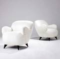 Vladimir kagan pair of barrelshaped lounge chairs with woven white upholstery on ebonized legs 32 12 x 29 x 29