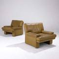 Walter knoll  steelcase pair of sirino lounge chairs with stitched tan leather upholstery marked brayton on upholstery also with brayton international paper tags 31 12 x 38 x 32
