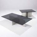 Paul mayen  habitat two low tables with dark bronze glass tops resting on brushed stainless steel bases 12 12 x 54 x 30 and 16 12 x 34 x 24