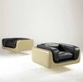 Steelcase pair of club chairs upholstered in black leather with fiberglass shell on lucite base steelcase label 24 12 x 40 12 x 32 12
