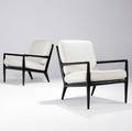 Th robsjohngibbings  widdicomb pair of spindleback lounge chairs with ebonized finish and ecru fabricupholstered cushions 31 12 x 24 12 x 26