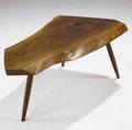 George nakashima walnut coffee table its freeedge top with one natural occlusion on turned wood legs marked with clients name 17 34 x 42 x 23